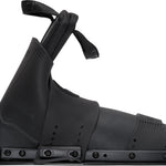 Side view of the front Stoker binding in black, featuring an open-toe design with adjustable straps and a sturdy baseplate.