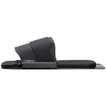 Side view of the Pivot RTP in black, showcasing a textured footbed with a flexible toe strap for rear foot positioning.