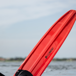 Close-up of the red tip of the Connelly 2024 Men's Concept ski, highlighting the textured surface and logo.