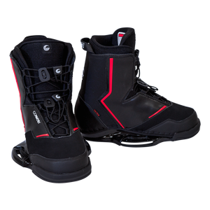 Pair of Faction wakeboard bindings with black boots, red accents, lace-up system, and flexible yet supportive design.