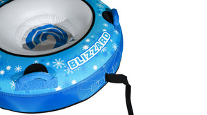 Angled close-up of Blizzard 56 Snow Tube interior seat, Blizzard graphics, and black tow strap.