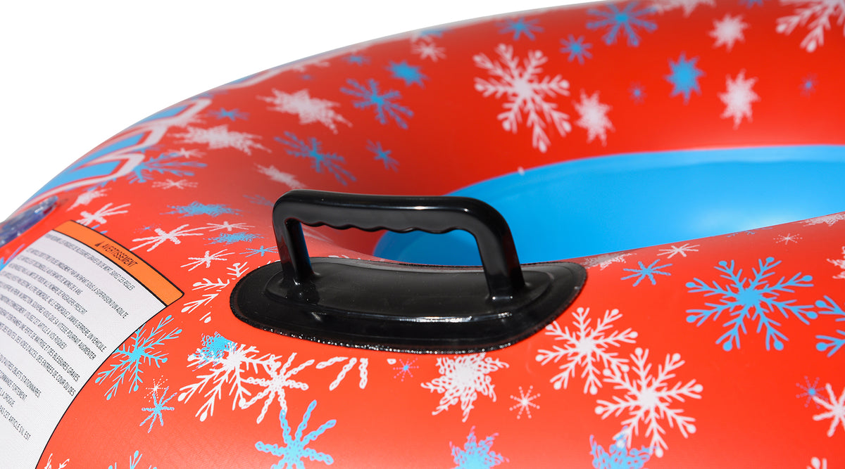 Close-up of Frosty 38 Snow Tube black hard-plastic handle on red snowflake-print vinyl.