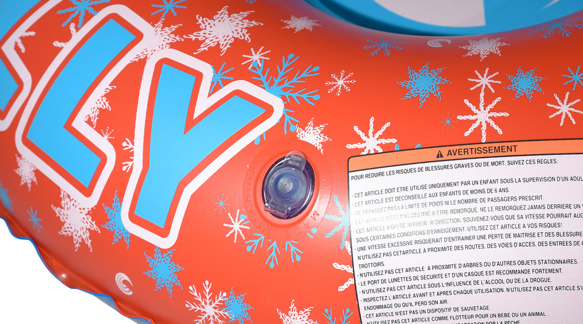 Close-up of Frosty 38 Snow Tube inflation valve and French-language warning label.