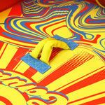 Close-up of Super Fun 3 padded handle on colorful swirl design surface.