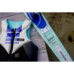 Women's Aspect ski and life vest resting on a wooden dock, with the ski featuring a teal and white design and blue bindings.