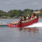 Rear view of Big Easy 4, showing the elevated seating and cushioned backrest as riders hold on.