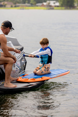 Jet ski-assisted child kneeboards with the Wild Thing.