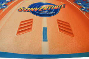Close-up of orange deck showing Convertible Soft Top logo and raised vented surface details.