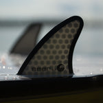 Close-up of the Seer wakesurf board’s fin, featuring a honeycomb pattern with “Seer 3.7” branding.