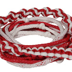 Close-up of coiled red and white Poly-E Rope showing braided pattern and smooth texture.