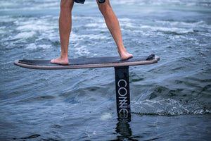 Close-up of a person riding the Pilot Foilboard in the water.