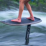 Person riding a Connelly wakefoil in the water.
