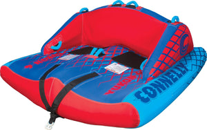 Left angle view of the Yukon 4, red and blue four-person towable tube with padded seating, backrest, and grab handles.