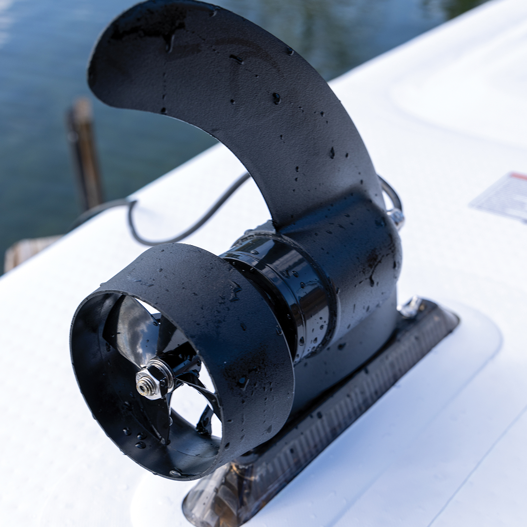 Close-up view of the Power Fin mounted on a paddleboard, displaying its black propeller and curved fin design.