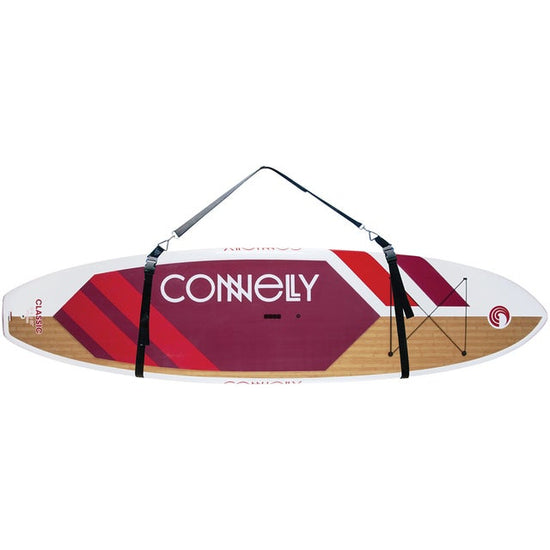 Stand-up paddleboard secured with the SUP Carry Strap, featuring adjustable black straps and a padded shoulder sling.