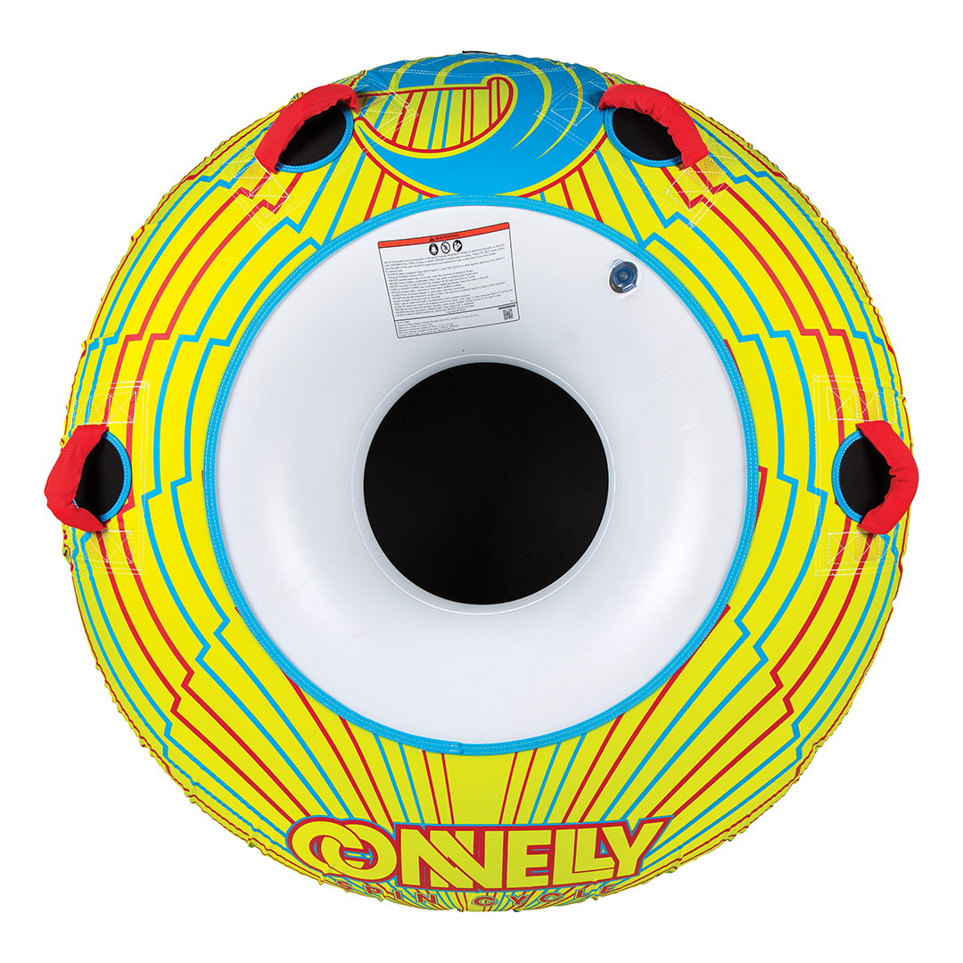 Top view of the Spin Cycle tube with a yellow and red geometric pattern, four red handles, and a white center opening.